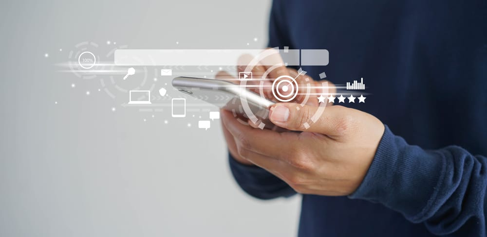 SEO icons over hands using a smartphone